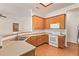 Functional kitchen with wood cabinets and modern appliances, offering a seamless cooking experience at 16768 W Nottingham Way, Surprise, AZ 85374