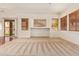 Open living area with plush carpet, large windows, and a view to the backyard at 16768 W Nottingham Way, Surprise, AZ 85374