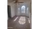 Bedroom with arched window and shutters, bathed in sunlight at 2333 E Southern Ave # 2037, Tempe, AZ 85282