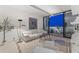 Bright living room with plush white furnishings and sliding doors to a balcony at 312 E Windsor Ave # 4, Phoenix, AZ 85004