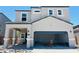 Two-story home featuring a covered entryway and a spacious garage at 5041 E Umber Rd, San Tan Valley, AZ 85143