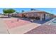 Charming exterior view of community building with a well-maintained brick entry and landscaping at 6705 E Des Moines St, Mesa, AZ 85205