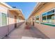 Exterior hallway with visible room titles, windows, and outdoor seating at 6705 E Des Moines St, Mesa, AZ 85205