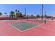 Outdoor pickleball courts with lush landscaping, palm trees, and comfortable seating at 6705 E Des Moines St, Mesa, AZ 85205