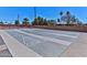 Well-maintained shuffleboard courts with brick surround, benches, and mature landscaping at 6705 E Des Moines St, Mesa, AZ 85205