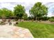 Well-maintained backyard with lush lawn and mature trees, offering a serene outdoor retreat at 10380 E Cholla St, Scottsdale, AZ 85260