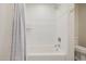 Clean bathroom featuring white subway tile and a shower with curtain at 10380 E Cholla St, Scottsdale, AZ 85260