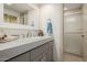 Bathroom with a gray vanity and a glass-enclosed shower at 10380 E Cholla St, Scottsdale, AZ 85260