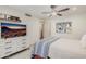 Bedroom featuring a sunset view TV, an adjacent closet, and decorative artwork at 10380 E Cholla St, Scottsdale, AZ 85260