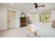 Neutral bedroom with a decorative chest of drawers and a view to the outside at 10380 E Cholla St, Scottsdale, AZ 85260