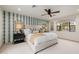 Bright main bedroom featuring patterned wallpaper, plush accents, and ample natural light at 10380 E Cholla St, Scottsdale, AZ 85260
