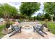 Cozy backyard fire pit area with stone seating, ideal for outdoor gatherings at 10380 E Cholla St, Scottsdale, AZ 85260