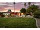 Sprawling desert home with beautiful, mature landscaping and bougainvillea highlighting the entryway at 10380 E Cholla St, Scottsdale, AZ 85260