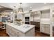Spacious kitchen with large island, stainless steel appliances, and ample cabinet space at 10380 E Cholla St, Scottsdale, AZ 85260