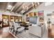 Inviting living room with vaulted ceilings, skylights, and walls adorned with eclectic art pieces at 10380 E Cholla St, Scottsdale, AZ 85260