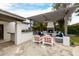 Stylish outdoor living area with a pergola, fireplace, and seating, perfect for relaxation and entertaining at 10380 E Cholla St, Scottsdale, AZ 85260