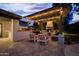 Cozy outdoor living space featuring a pergola, fireplace, and built-in grill, perfect for entertaining and relaxation at 10380 E Cholla St, Scottsdale, AZ 85260