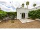 Secluded outdoor patio with gravel, seating, and greenery at 10380 E Cholla St, Scottsdale, AZ 85260