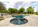 Stunning backyard pool and spa area, surrounded by lush landscaping and comfortable lounge seating at 10380 E Cholla St, Scottsdale, AZ 85260