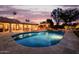 Sparkling swimming pool with a spacious patio area, ideal for enjoying warm evenings and outdoor gatherings at 10380 E Cholla St, Scottsdale, AZ 85260