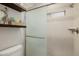 Bathroom featuring glass enclosed shower, mosaic tiles, and floating wood shelf at 10380 E Cholla St, Scottsdale, AZ 85260