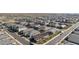 An elevated shot of a neighborhood showcasing various single-Gathering homes with desert landscaping and connected streets at 11423 E Utah Ave, Mesa, AZ 85212