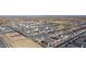 An aerial view of a new residential community featuring neatly arranged homes and well-planned street layouts at 11423 E Utah Ave, Mesa, AZ 85212