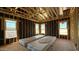 Bedroom with wooden framing and multiple windows displaying the neighborhood landscape at 11423 E Utah Ave, Mesa, AZ 85212