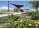 Community park featuring a playground, benches, and flower garden offering a recreational space at 11423 E Utah Ave, Mesa, AZ 85212