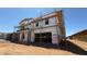 Image of a home's exterior, currently under construction, showcasing the garage and scaffolding at 11423 E Utah Ave, Mesa, AZ 85212