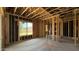 The wood framing and windows in this new construction home show promise at 11423 E Utah Ave, Mesa, AZ 85212