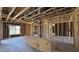 Wood framing of a new construction featuring exposed ceiling and concrete flooring at 11423 E Utah Ave, Mesa, AZ 85212