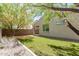 A well-manicured backyard featuring artificial grass and low-maintenance landscaping for easy outdoor enjoyment at 14114 W Surrey Dr, Surprise, AZ 85379