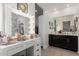 Bathroom featuring a lighted mirror, make up vanity, and walk in shower at 14114 W Surrey Dr, Surprise, AZ 85379