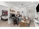 Bedroom featuring a desk area, sofa, and access to a second bedroom at 14114 W Surrey Dr, Surprise, AZ 85379