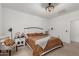 Bedroom with comfortable queen bed, decorative lamps, side tables and linens at 14114 W Surrey Dr, Surprise, AZ 85379