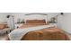 Bedroom with comfortable queen bed, decorative lamps, side tables and linens at 14114 W Surrey Dr, Surprise, AZ 85379