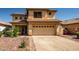 Charming two-story home featuring a spacious two-car garage, desert landscaping, and a tile roof at 14246 W Columbus Ave, Goodyear, AZ 85395