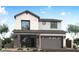 Charming two-story home featuring a modern design, two-car garage, and manicured landscaping at 1549 E Eleana Ln, Gilbert, AZ 85298