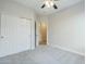 Bedroom featuring plush carpeting, double sliding door closet and neutral colored walls at 1584 E Harrison E St, Chandler, AZ 85225