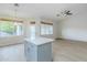 Kitchen island with gray cabinets and white countertop, complemented by natural lighting at 1584 E Harrison E St, Chandler, AZ 85225