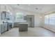 Stylish kitchen with gray cabinets, modern appliances, and a central island at 1584 E Harrison E St, Chandler, AZ 85225