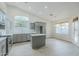 Bright kitchen featuring gray cabinets, stainless steel appliances, and a kitchen island at 1584 E Harrison E St, Chandler, AZ 85225