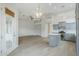 Bright, open living space featuring modern lighting, neutral walls, and wood-look flooring at 1584 E Harrison E St, Chandler, AZ 85225