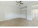 Spacious living room featuring built-in alcoves and wood-look flooring at 1584 E Harrison E St, Chandler, AZ 85225
