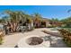 Entertainer's backyard featuring a firepit and patio area at 16753 W Bristol Ln, Surprise, AZ 85374
