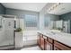 Bright bathroom featuring a shower and soaking tub at 16753 W Bristol Ln, Surprise, AZ 85374