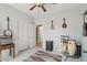 Music room or bedroom featuring carpeted floors, a ceiling fan, and ample space for instruments at 16753 W Bristol Ln, Surprise, AZ 85374