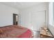 Bedroom boasts a ceiling fan, and natural light, offering a relaxing atmosphere and convenient closet access at 16753 W Bristol Ln, Surprise, AZ 85374