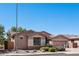 Charming single-story home with well-maintained landscaping and a welcoming entrance at 16753 W Bristol Ln, Surprise, AZ 85374